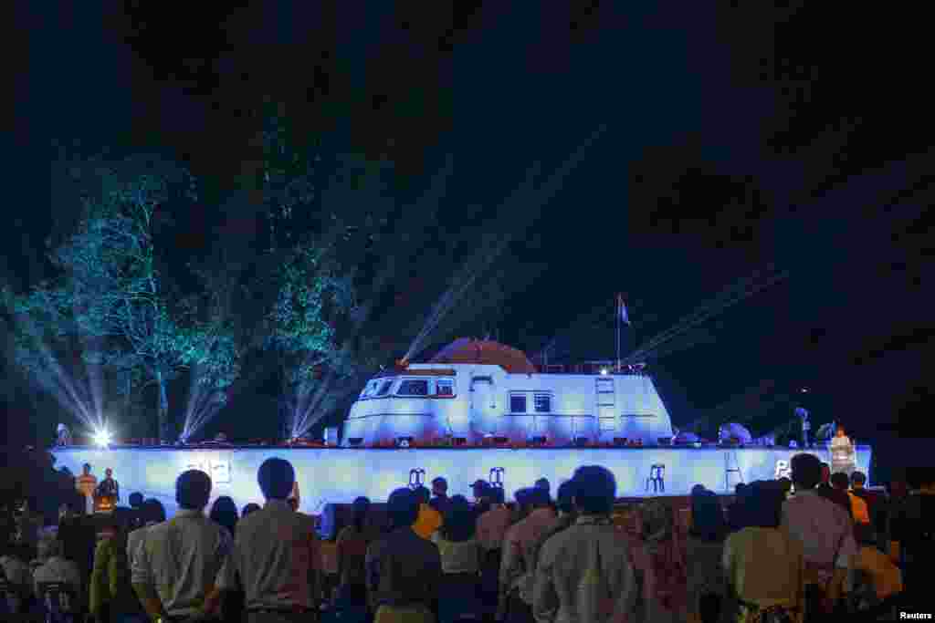 People look on ahead of the tenth anniversary of the 2004 tsunami at the police boat T813 tsunami memorial in Khao Lak, Phang Nga province December 25, 2014. On December 26, 2004, a magnitude 9.15 quake off the coast of Indonesia's Aceh province triggered