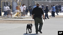 FILE - Inmates are seen exercising in the main yard at California State Prison in Vacaville, California, May 20, 2015. Incarcerations in the U.S. of nonviolent drug offenders are seen as disproportionately high.