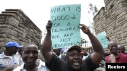 Teachers demonstrate outside Kenya's Parliament Buildings in the capital Nairobi September 7, 2011. Many Kenyan state schools remained closed on Tuesday after thousands of teachers went on strike to try to force the government to increase their numbers. T