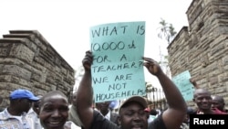 Teachers demonstrate outside Kenya's Parliament Buildings in the capital Nairobi September 7, 2011. Many Kenyan state schools remained closed on Tuesday after thousands of teachers went on strike to try to force the government to increase their numbers.