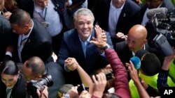 Ivan Duque, candidate of the Democratic Center party, greets supporters after voting during a presidential election in Bogota, Colombia, June 17, 2018.