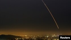 An unarmed Minuteman III intercontinental ballistic missile streaks through the sky of Vandenberg in California Aug. 25, 2005.
