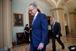 Senate Minority Leader Charles Schumer of New York walks to his office on Capitol Hill in Washington, April 6, 2017, as Republican Leader Mitch McConnell is expected to change Senate rules to guarantee confirmation of Supreme Court nominee Neil Gorsuch.
