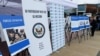 Dolkun Isa, President of the World Uyghur Congress, sets up the display of people who are missing or alleged to be held in Chinese-run camps in Xinjiang, China, in front of the United Nations on Sept. 16, 2021.