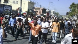 Haitians march in the streets of Port-au-Prince, to protest against the government, February 7, 2011