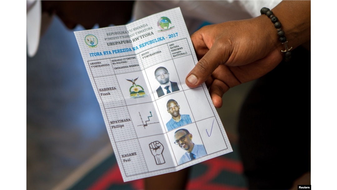 A polling staff member counts ballots at a polling center in Kigali, Rwanda, Aug. 4, 2017.
