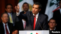 FILE - Enrique Ochoa delivers a speech after becoming the new chairman of the Institutional Revolutionary Party (PRI), at PRI headquarters, in Mexico City, Mexico, July 12, 2016. 