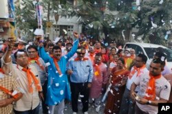 Bharatiya Janata Party (BJP) supporters celebrate the party's victory in local body elections in Ahmadabad, India, Friday, Nov. 25, 2016.