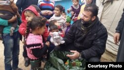 Rami Adham delivers toys to Syrian children in a refugee camp near the war-torn city of Aleppo in February 2016. (Photo courtesy of Rami Adham) 