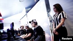 Is extreme gaming similar to a drug addiction? Here, a referee watches over competitors during a video game tournament in Toronto, Canada, March 26, 2017. (REUTERS/Mark Blinch)