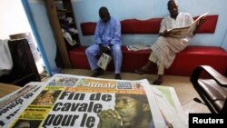 The front page of a newspaper featuring the arrest of Ivorian political leader Charles Ble Goude is seen in Abidjan, Ivory Coast, January, 18, 2013. 