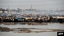 FILE - The make-shift shanty Makoko community built on the lagoon shows the extreme poverty and inequality between the rich and the poor in Lagos, Nigeria's commercial capital, Jan. 23, 2019. 
