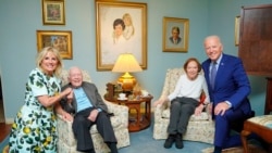 In this April 30, 2021, photo released by The White House, former President Jimmy Carter and former first lady Rosalynn Carter pose for a photo with President Joe Biden and first lady Jill Biden at the home of the Carter's in Plains, Georgia. (Adam Schultz, The White House via AP))