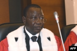 FILE - The president of the tribunal Gberdao Gustave Kam of Burkina Faso is seen in the courtroom during the first proceedings of the trial of Chadian dictator Hissene Habre, by the Extraordinary African Chambers in Dakar on July 20, 2015.