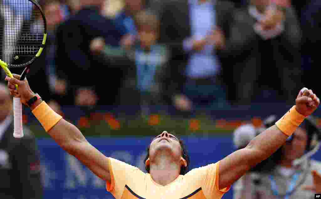 Rafael Nadal celebrates his victory over Fabio Fognini, of Italy, during the Barcelona Open tennis tournament in Barcelona, Spain.
