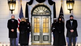 President Joe Biden, First Lady Jill Biden, Vice President Kamala Harris and her husband Doug Emhoff, bow their heads during a ceremony to honor the 500,000 Americans that died from COVID-19, at the White House, Monday, Feb. 22, 2021, in Washington. (AP Photo/Evan Vucci)