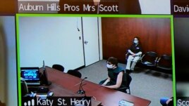 Ethan Crumbley, center, appears on a video arraignment at 52nd District Court in Rochester Hills, Mich., Wednesday, Dec. 1, 2021. Authorities say Crumbley, 15-year-old sophomore, opened fire at Oxford High School, killing four students and wounding seven.