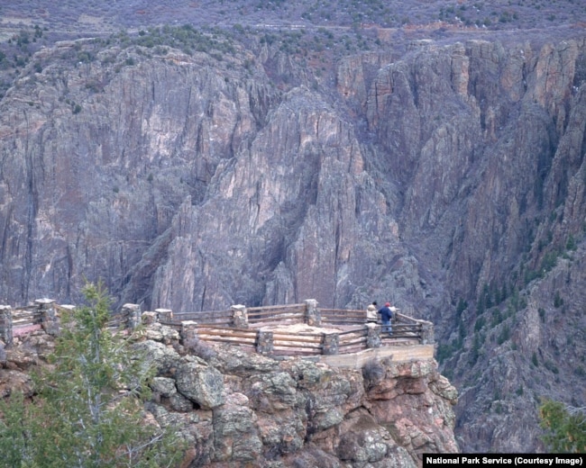 People look out at Gunnison Point