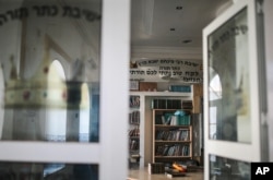 Jewish holy books are seen at a library at Hara Kbira, on the island of Djerba, southern Tunisia, Oct. 30, 2015.