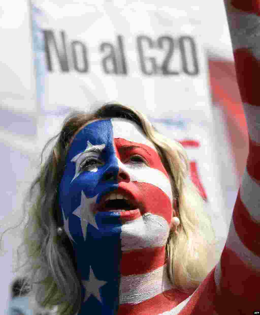 Body-painted activists take part in a protest against the G-20 Leaders&#39; Summit taking place in Buenos Aires, Argentina.