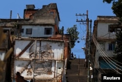 Graffiti are seen on a building in the Morro da Providencia slum in Rio de Janeiro, Nov. 29, 2012.