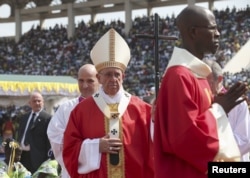 Pope Francis arrives to lead a mass at the Bangui stadium, Central African Republic, Nov. 30, 2015.