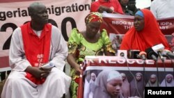 Esther Yakubu (C), the mother of the girl who introduced herself as Maina Yakubu in the recent Boko Haram video, attends a protest march in Abuja, Nigeria, Aug. 22, 2016. 