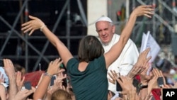 Pope Francis arrives for a meeting with faithful on the occasion of a Pentecostal vigil St. Peter Square at the Vatican, May 18, 2013.