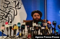 FILE - The Taliban's foreign minister, Amir Khan Muttaqi, speaks to the media in Kabul, Afghanistan, Sept. 14, 2021.