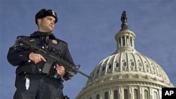 Capitol Police officer Angel Morales stands guard on the West side of the Capitol in Washington after a man was arrested in an FBI sting operation near the U.S. Capitol while planning to detonate what police say he thought were live explosives, February 1