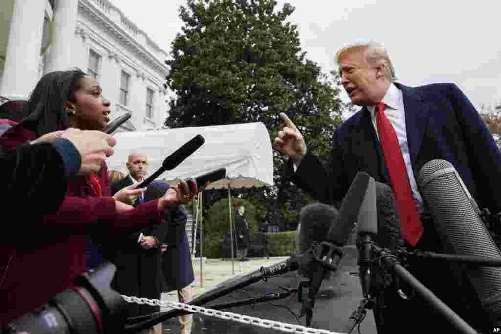 CNN journalist Abby Phillip asks President Donald Trump a question as he speaks with reporters before departing for France on the South Lawn of the White House.