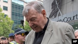 Cardinal George Pell leaves the County Court in Melbourne, Australia, Feb. 26, 2019. The most senior Catholic cleric ever charged with child sex abuse has been convicted of molesting two choir boys.