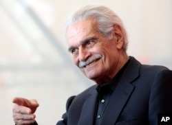 Omar Sharif gestures during the photo call for the film 'Al Mosafer (The Traveller)' at the 66th edition of the Venice Film Festival in Venice, Italy, Sept. 10, 2009.