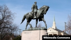 FILE - A statue of Confederate General Robert E. Lee in a Charlottesville, Va., park. 