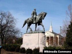 FILE - A statue of Confederate General Robert E. Lee in a Charlottesville, Va., park.