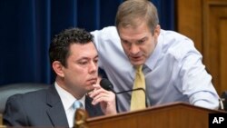 House Oversight and Government Reform Committee Chairman Rep. Jason Chaffetz, R-Utah, left, confers with committee member Rep. Jim Jordan, R-Ohio, on Capitol Hill in Washington, on Dec. 17, 2015. 