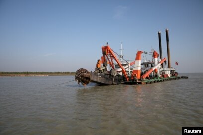 FILE - A dredging machine is seen near the island of Bhasan Char, in the Bay of Bengal, Bangladesh. Feb. 14, 2018.