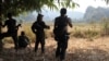 FILE - Soldiers of the Karen National Union (KNU) stand guard in Hpa-an district, Karen State, Myanmar. 