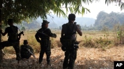 FILE - Soldiers of Karen National Union (KNU) stand guard in Hpa-an village, Karen State, Myanmar. 