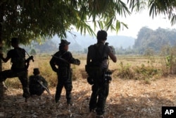 FILE - Soldiers of Karen National Union (KNU) stand guard in Hpa-an village, Karen State, Myanmar.