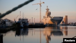 FILE - The Mistral helicopter assault ship Vladivostok, which Russia ordered from France, is seen at France's Atlantic port of Saint-Nazaire, Sept. 4, 2014.