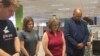 Employees in the Clarion Ledger newsroom in Jackson, Miss., observe a moment of silence, July 5, 2018, to honor five people shot to death a week earlier at the Capital Gazette in Annapolis, Md. Pictured are editorial cartoonist Marshall Ramsey, reporter Sarah Fowler, editor Barbara Gauntt, reporter Jimmie Gates and editor Tammy Ramsdell.