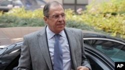 Russia's Foreign Minister Sergei Lavrov arrives for an EU foreign ministers meeting at the European Council building in Brussels, Dec. 16, 2013.