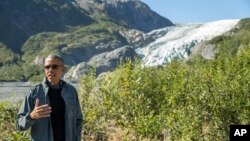 President Barack Obama speaks to members of the media while on a hike to the Exit Glacier in Seward, Alaska, Sept. 1, 2015. (AP Photo/Andrew Harnik)