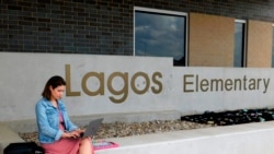 First-year teacher Cindy Hipps sits outside of Lagos Elementary School, at Manor Independent School District campus east of Austin, Texas