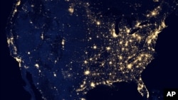 This composite image made available by NASA and assembled by data acquired from the Suomi NPP satellite in April and October 2012 uses the satellite’s Visible Infrared Imaging Radiometer Suite (VIIRS), to show the U.S's lights at night.