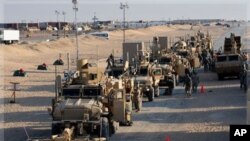 US Army soldiers from the 1st Cavalry Division, the last soldiers to leave Iraq, arrive at Camp Virginia, Kuwait, Dec. 18, 2011.