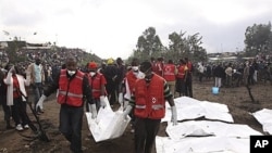 Red Cross workers collect bodies after a pipeline explosion on Monday, Sept. 12, 2011.
