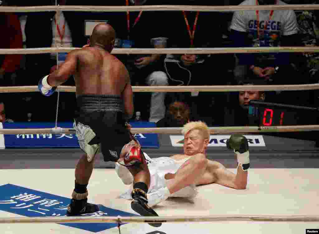 Floyd Mayweather knocks down Tenshin Nasukawa of Japan in the first round of their three-round exhibition match on New Year&#39;s Eve, at Saitama Super Arena in Saitama, north of Tokyo, Japan.