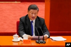 Chinese President Xi Jinping delivers a speech at an event commemorating the 110th anniversary of Xinhai Revolution at the Great Hall of the People in Beijing, Oct. 9, 2021.